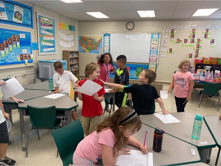 third grade students working together