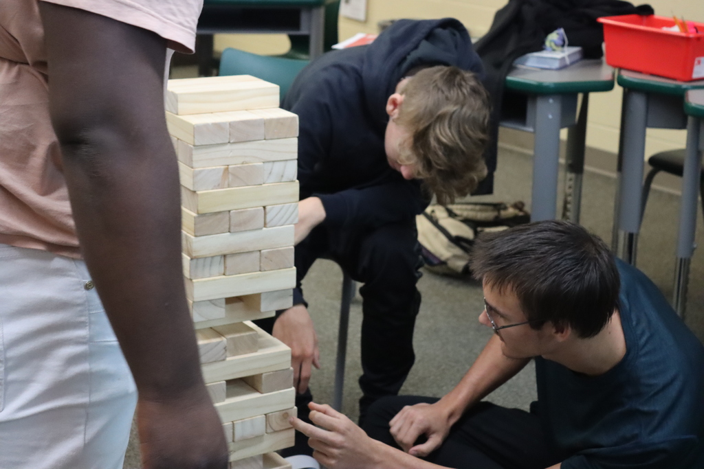 Students building Jenga tower